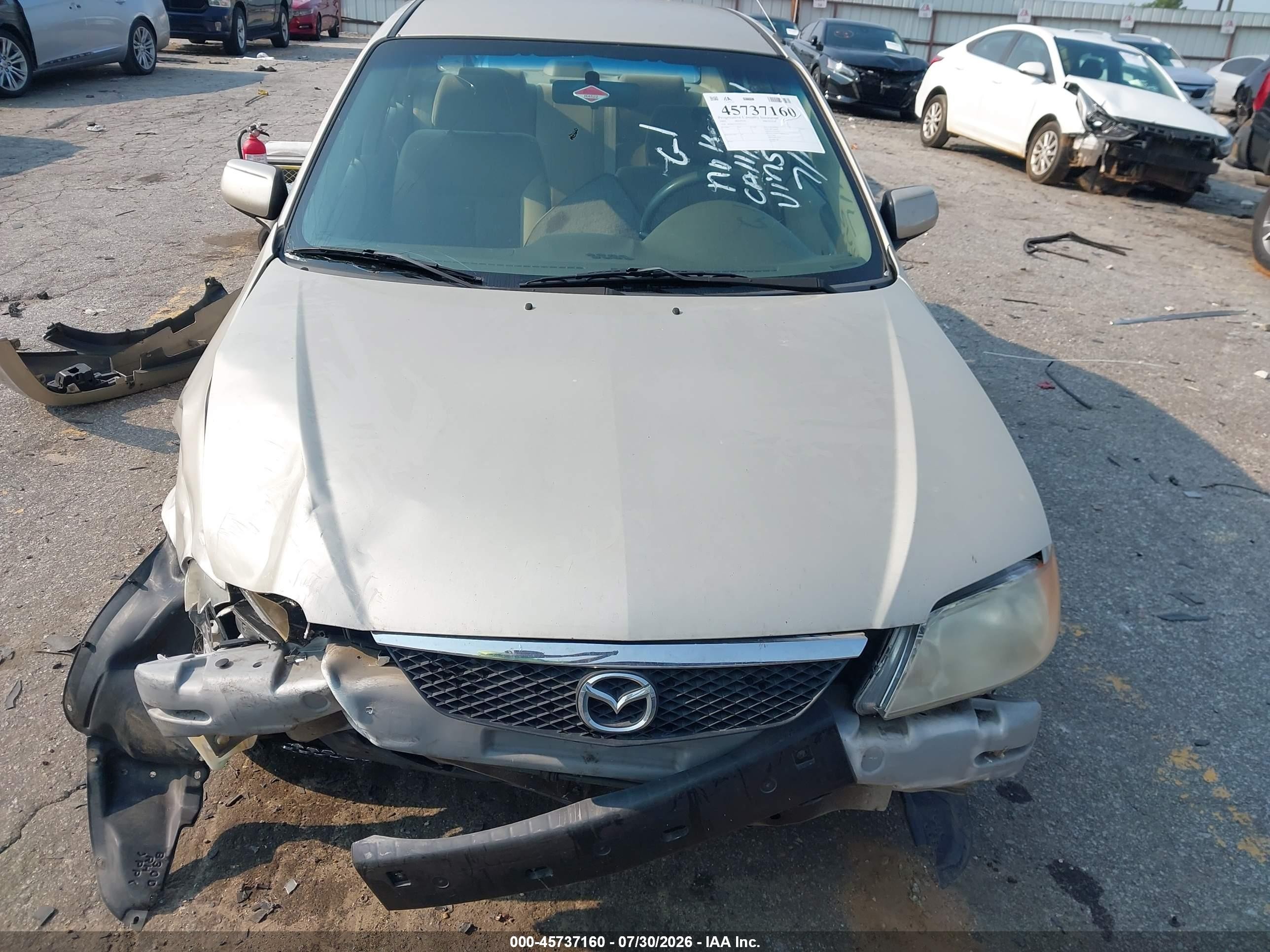 2002 Mazda Protege Dx/es/lx Желто-коричневый vin: JM1BJ225520515735