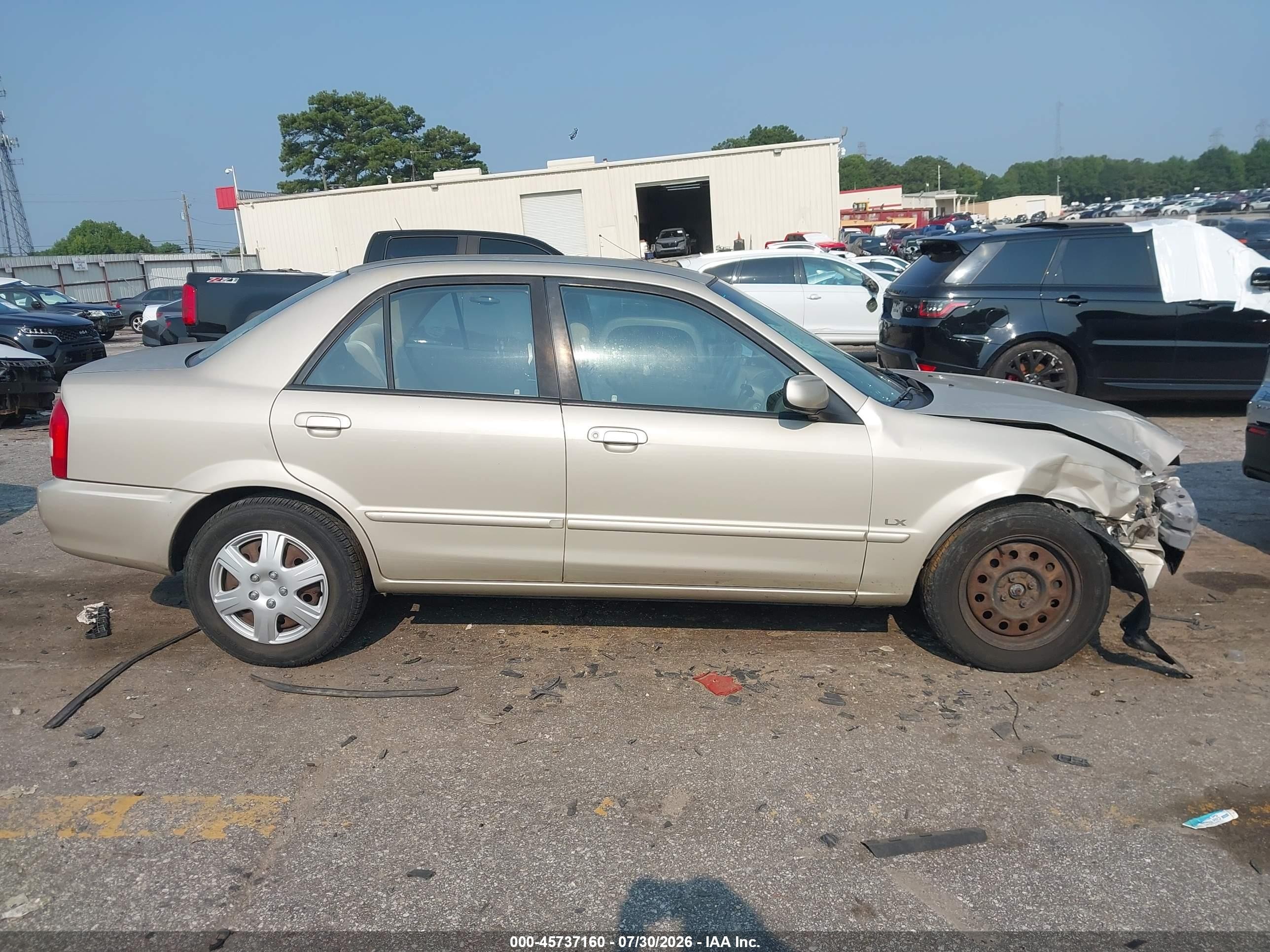 2002 Mazda Protege Dx/es/lx Желто-коричневый vin: JM1BJ225520515735