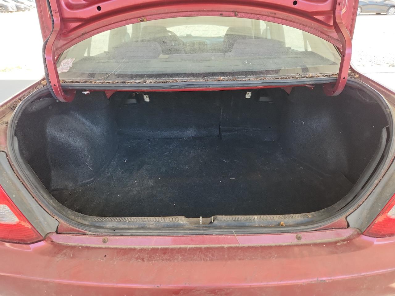 2001 Mazda Protege Lx Maroon vin: JM1BJ225710424030 Damage: Trunk/Cargo Mat, Stained, Permanent