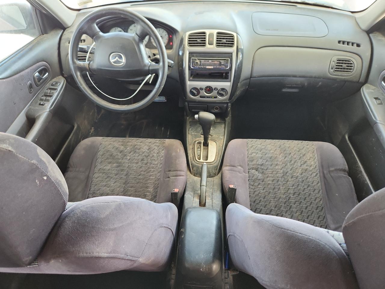 2001 Mazda Protege Lx Maroon vin: JM1BJ225710424030 Damage: Left Front Seat, Stained, Permanent