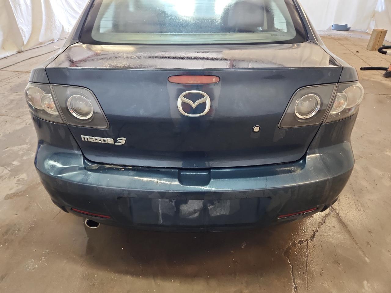 2008 Mazda 3 Blue vin: JM1BK32F781114413 Damage: Rear Bumper, Dent(S) W/ Paint Dmg, > 12 Inches