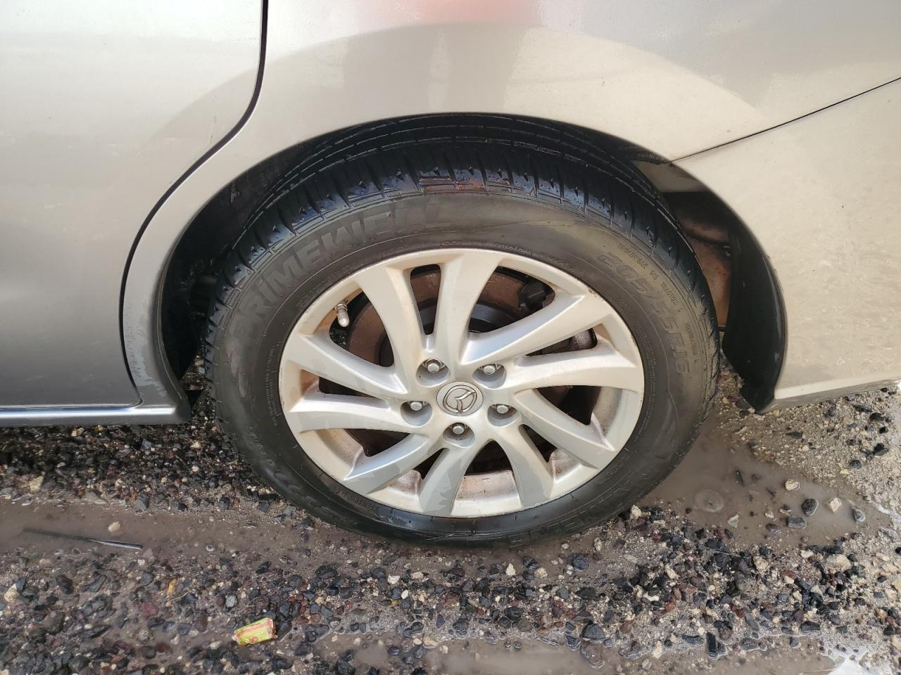 2012 Mazda 5 Silver vin: JM1CW2BL9C0115537 Damage: Left Qtr Panel, Peeling, > 12 Inches