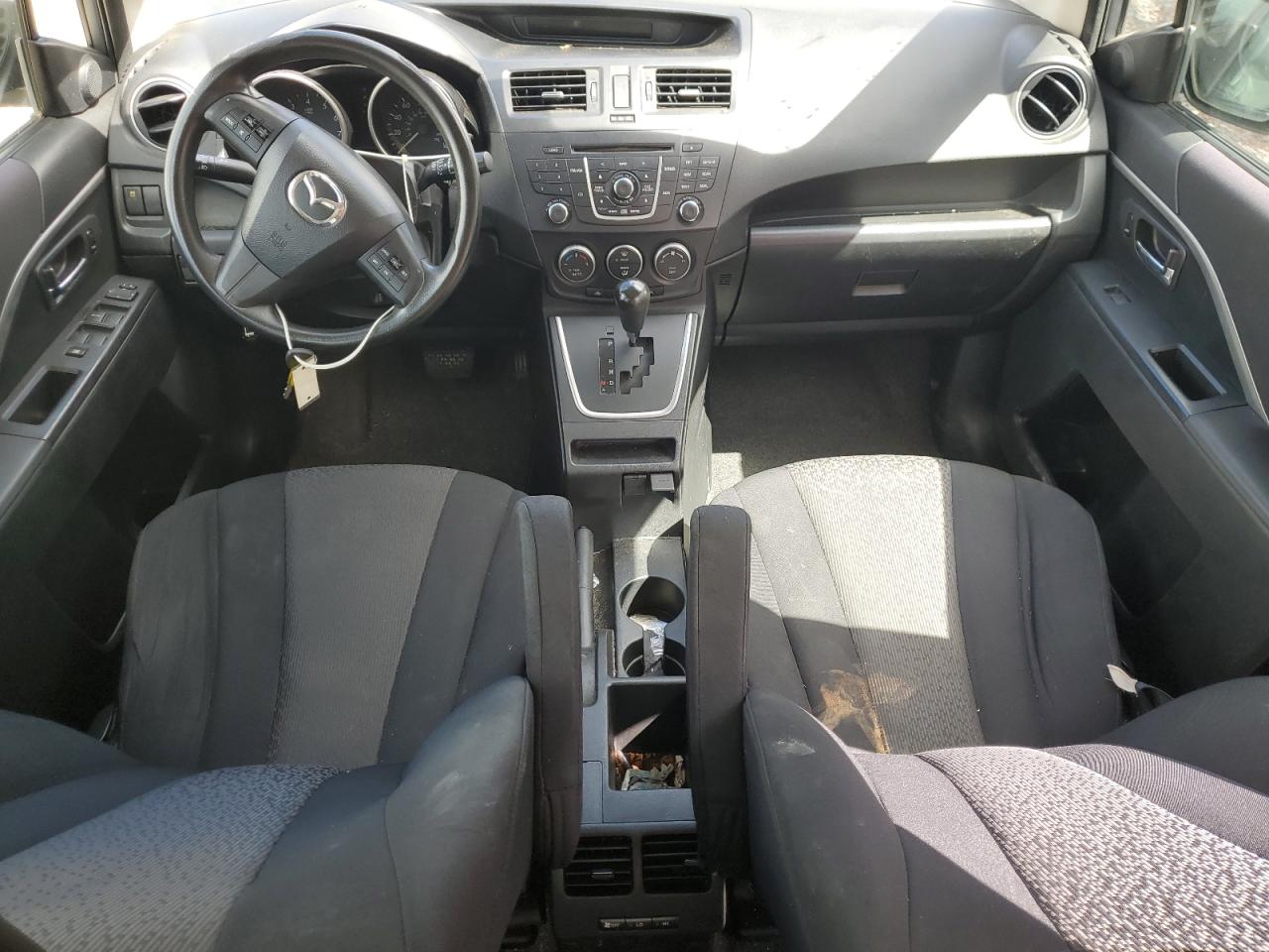 2012 Mazda 5 Silver vin: JM1CW2BL9C0115537 Damage: Right Front Seat Cushion, Stained, Permanent