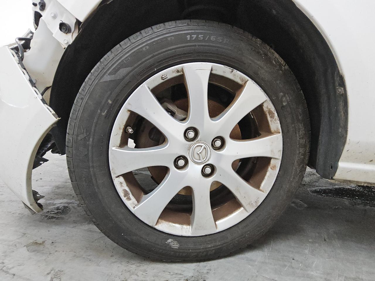 2011 Mazda Mazda2 White vin: JM1DE1HY9B0102998 Damage: Left Front Wheel, Curb Rash, 9 To 10 Inches