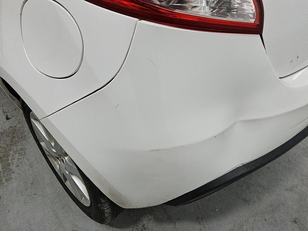 2011 Mazda Mazda2 White vin: JM1DE1HY9B0102998 Damage: Rear Bumper/Cover, Dent(S) W/ Paint Dmg, 4 To 5 Inches