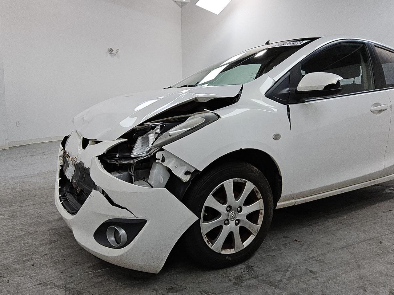 2011 Mazda Mazda2 White vin: JM1DE1HY9B0102998 Damage: Left Front Fender, Dent(S) W/ Paint Dmg, 7 To 8 Inches