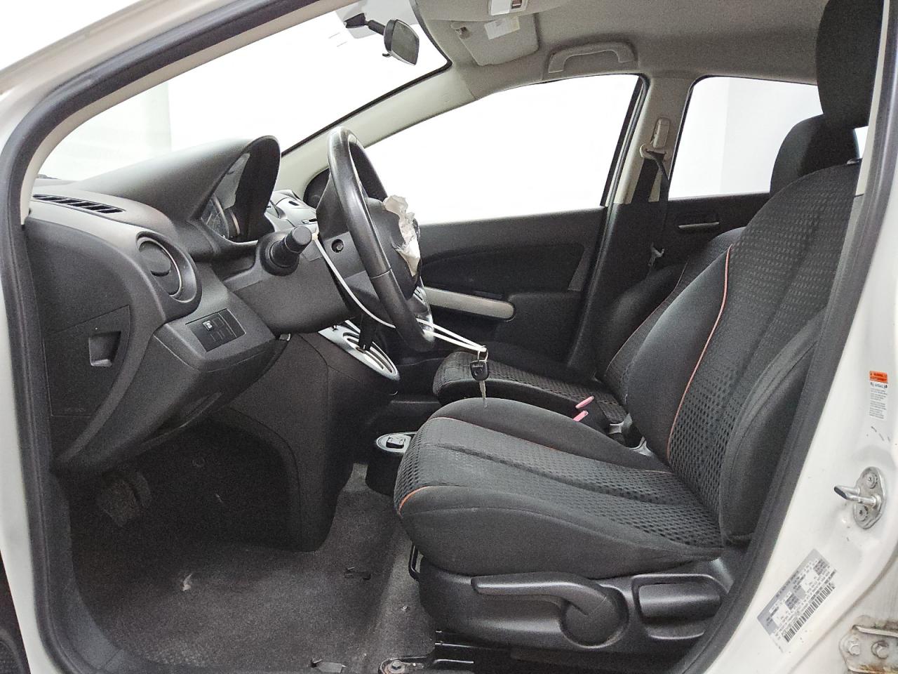 2011 Mazda Mazda2 White vin: JM1DE1HY9B0102998 Damage: Airbag - Front Left, Deployed, Replacement Required
