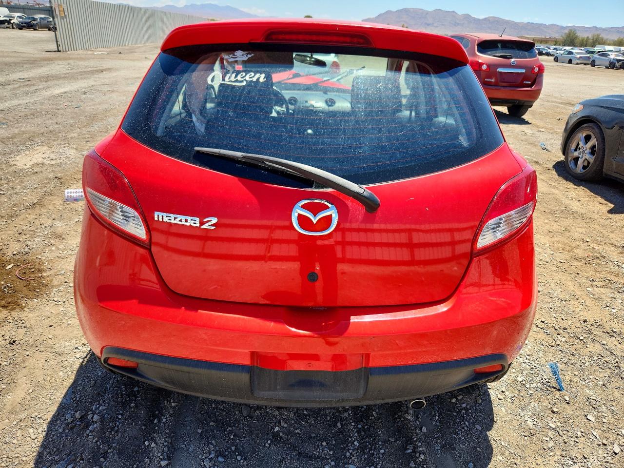 2011 Mazda Mazda2 Red vin: JM1DE1HZ7B0102099