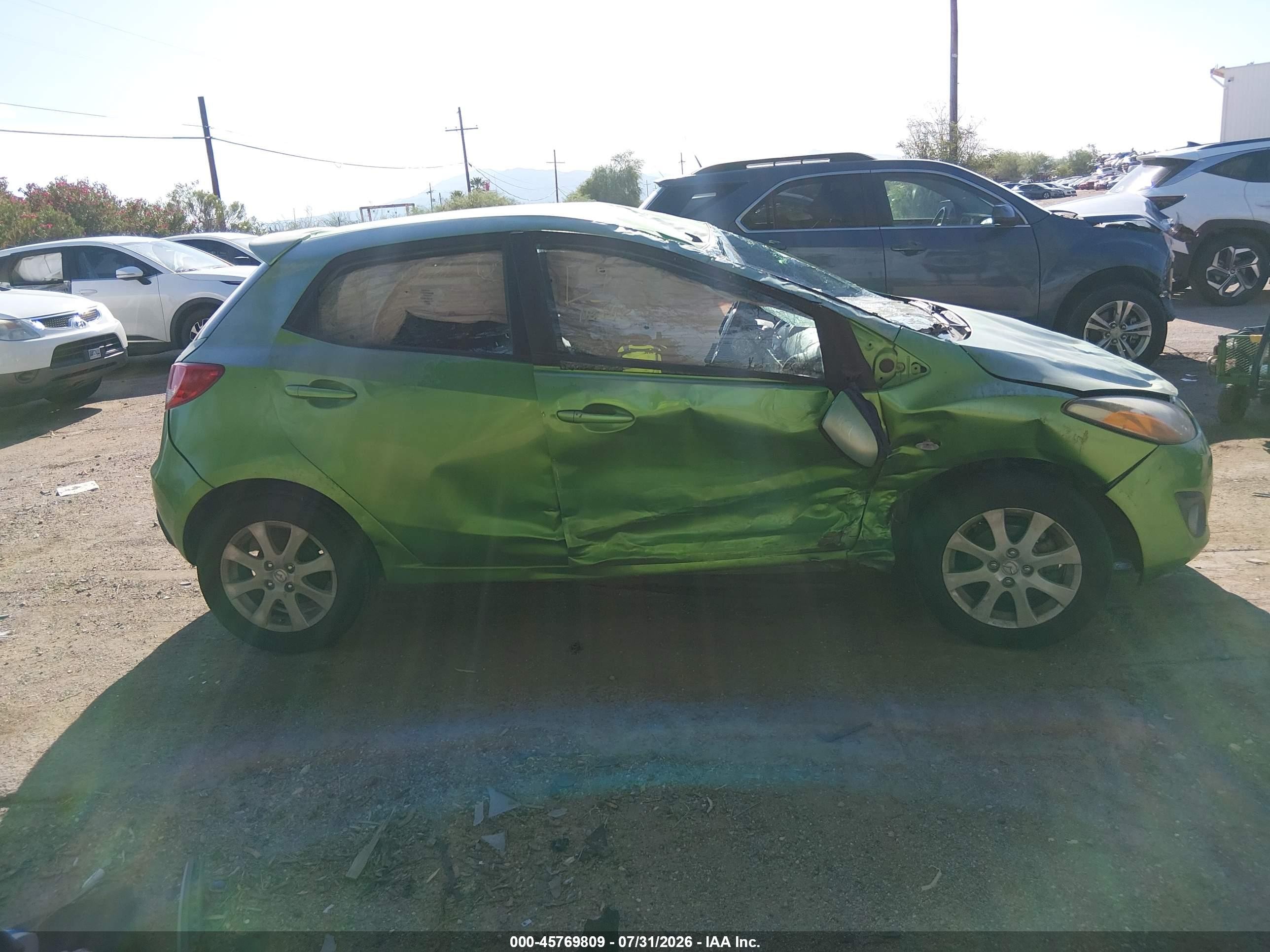 2011 Mazda Mazda2 Touring Green vin: JM1DE1HZ8B0112804