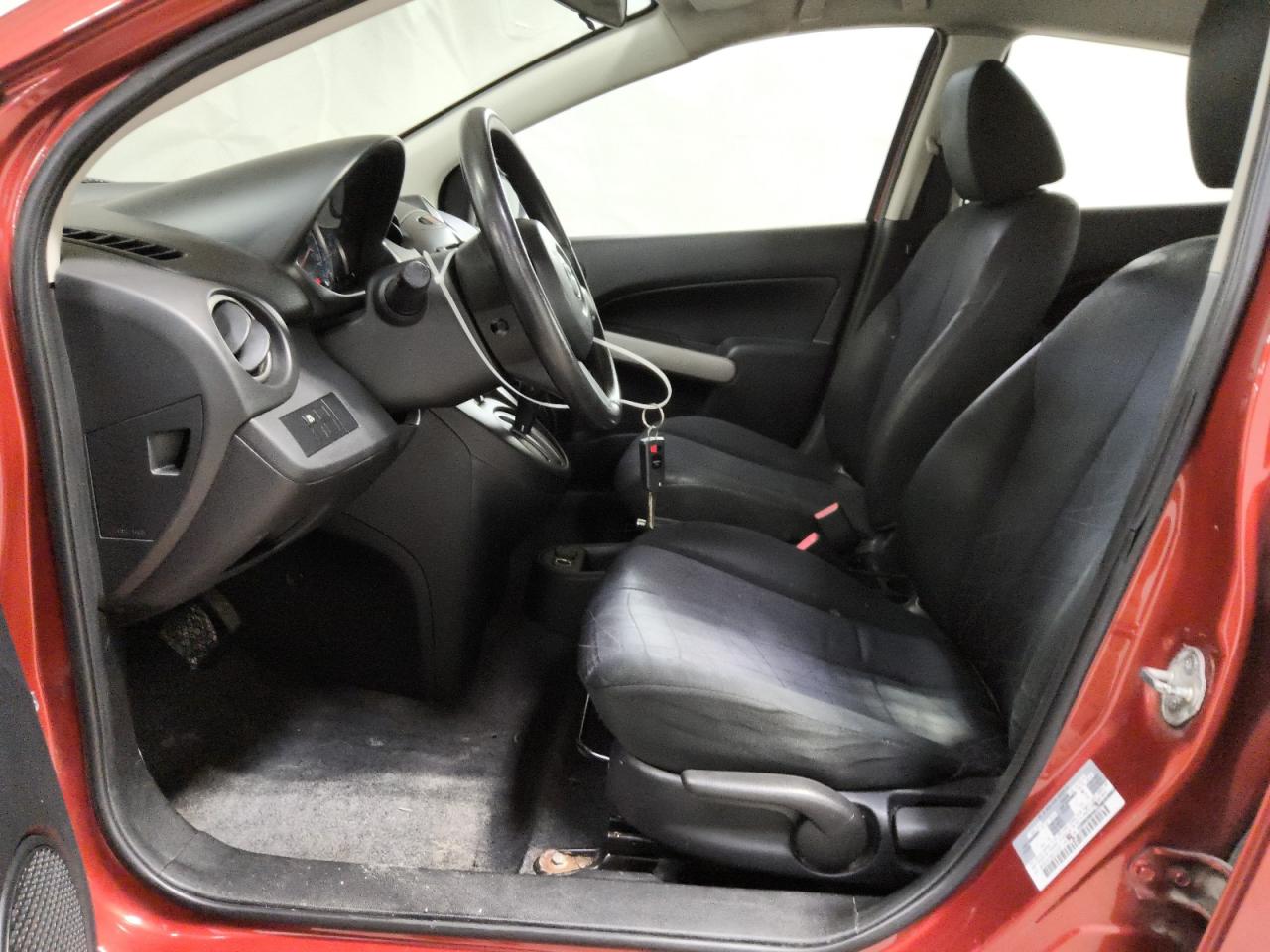 2014 Mazda Mazda2 Sport Burgundy vin: JM1DE1KY0E0174167 Damage: Left Front Carpet, Stained, Permanent