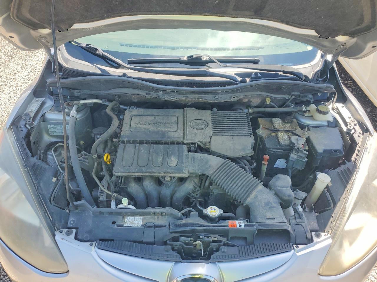 2012 Mazda Mazda2 Серебряный vin: JM1DE1LYXC0136599
