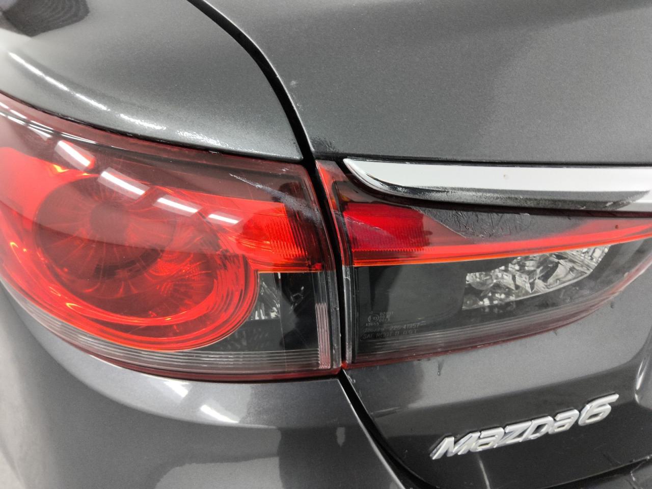 2015 Mazda 6 Touring Gray vin: JM1GJ1V51F1220028 Damage: Left Tail Light, Heavy Scratch, Replacement Required