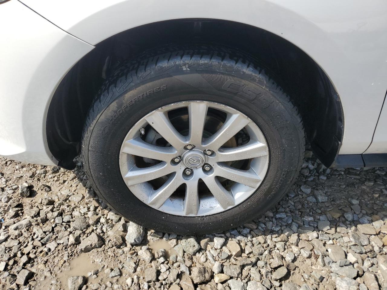 2011 Mazda Cx-7 White vin: JM3ER2C54B0355696 Damage: Left Front Wheel, Curb Rash, > 12 Inches