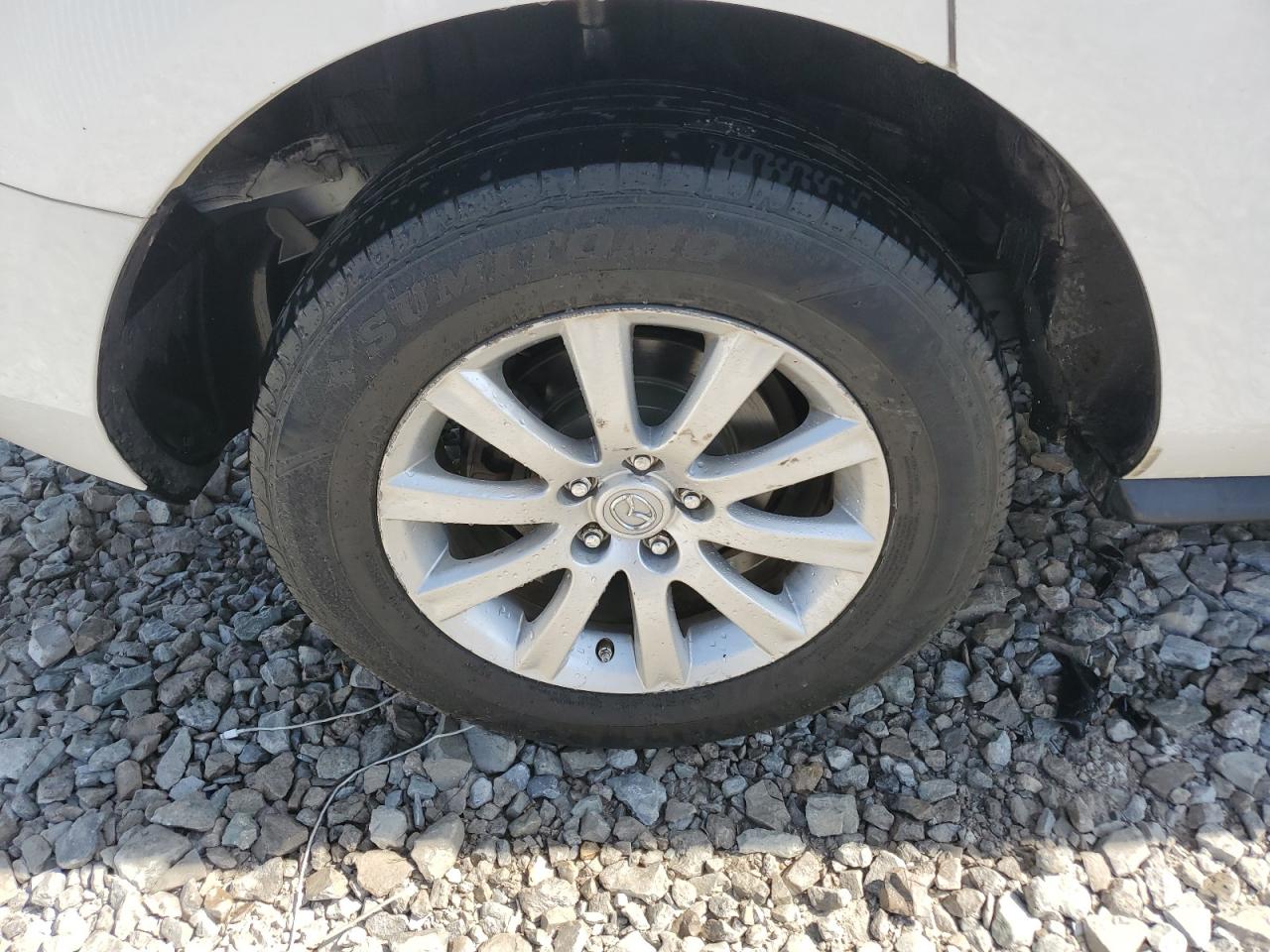 2011 Mazda Cx-7 White vin: JM3ER2C54B0355696 Damage: Right Rear Wheel, Curb Rash, > 12 Inches