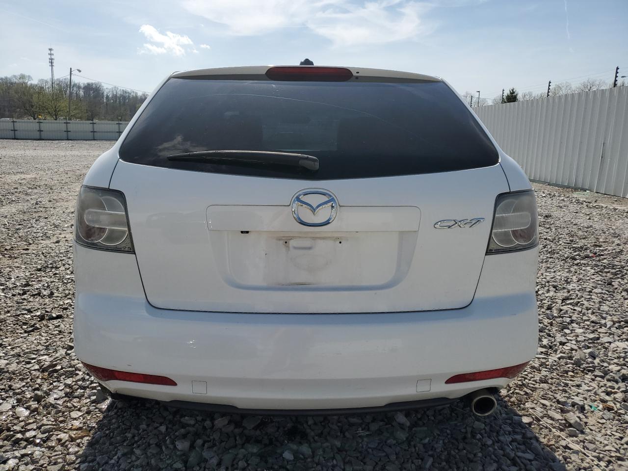 2011 Mazda Cx-7 White vin: JM3ER2C54B0355696 Damage: Rear Bumper, Heavy Scratch, 1/2 To 1 Inch