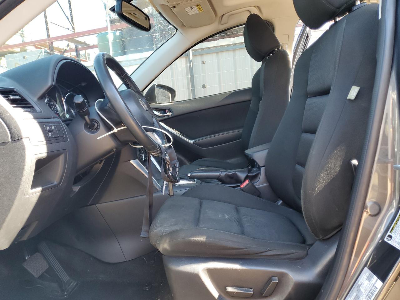 2014 Mazda Cx-5 Charcoal vin: JM3KE2CY4E0414386 Damage: Left Front Seat Cushion, Stained, Permanent