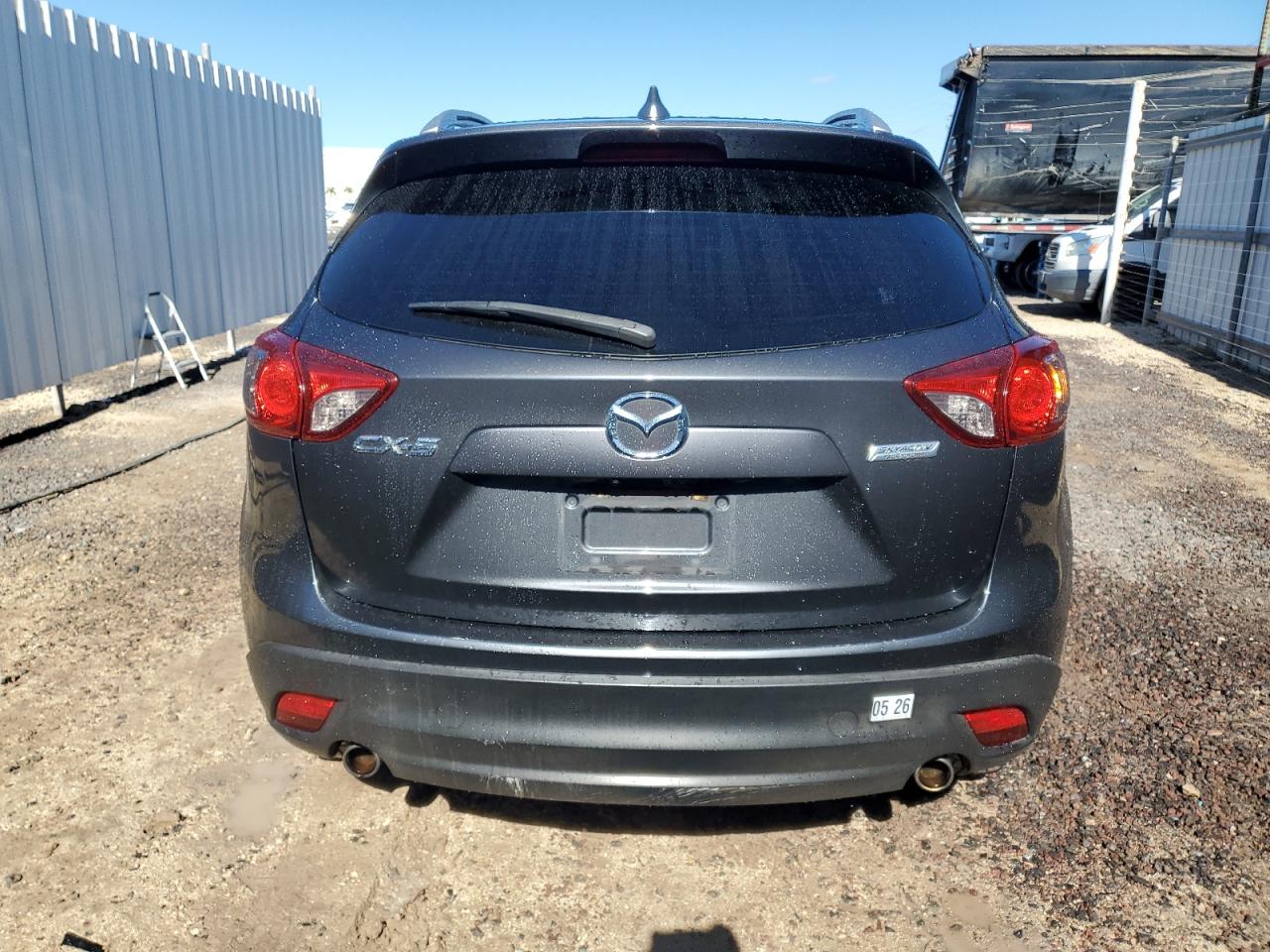 2014 Mazda Cx-5 Charcoal vin: JM3KE2CY4E0414386 Damage: Rear Bumper, Gouged, 8 To 9 Inches