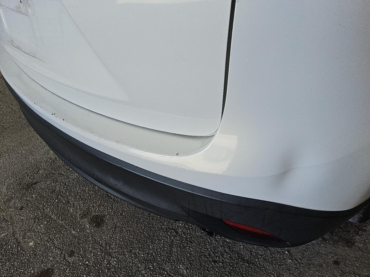 2014 Mazda Cx-5 Touring White vin: JM3KE2CYXE0340035 Damage: Rear Bumper Cover Upper, Dent(S) W/No Paint Dmg, 2 To 3 Inches