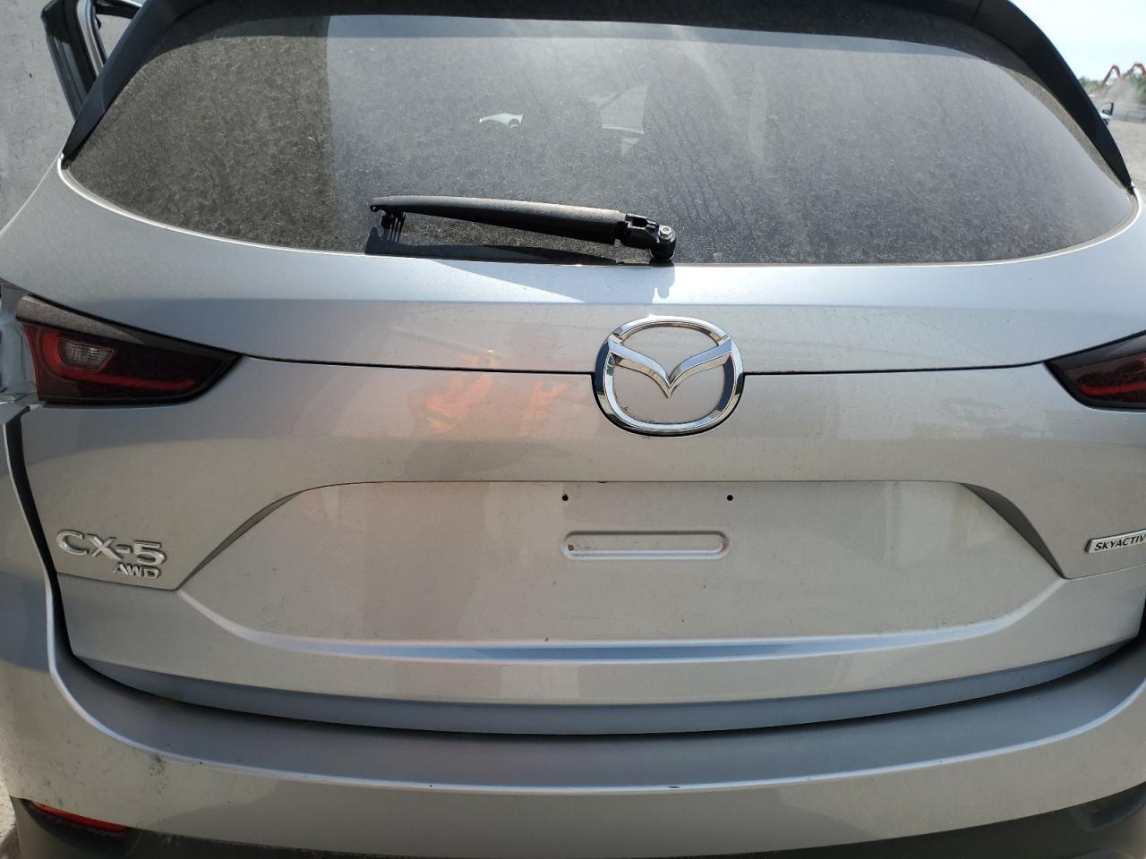2023 Mazda Cx-5 Premium Silver vin: JM3KFBDM7P0203064 Damage: Rear Bumper, Multiple Scratches Light, 3