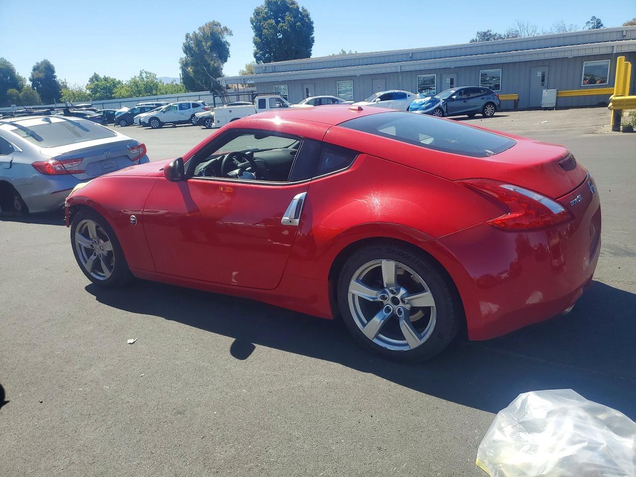 2009 Nissan 370z Base Red vin: JN1AZ44E09M407106