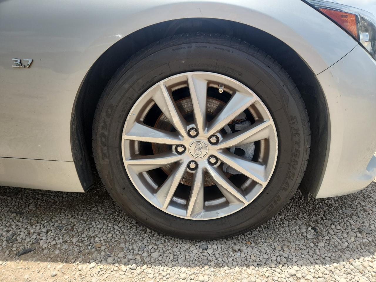 2015 Infiniti Q50 Premium Серебряный vin: JN1BV7AP5FM336827 Damage: Right Front Wheel, Curb Rash, > 12 Inches