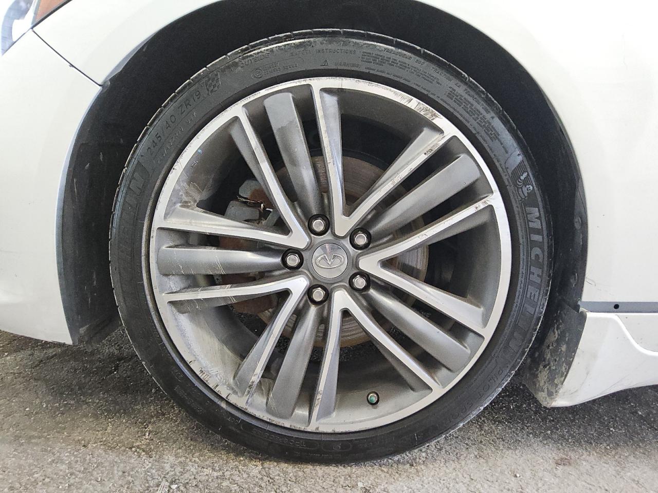 2015 Infiniti Q50 Premium White vin: JN1BV7AP9FM338144 Damage: Left Front Tire, Worn, Replacement Required