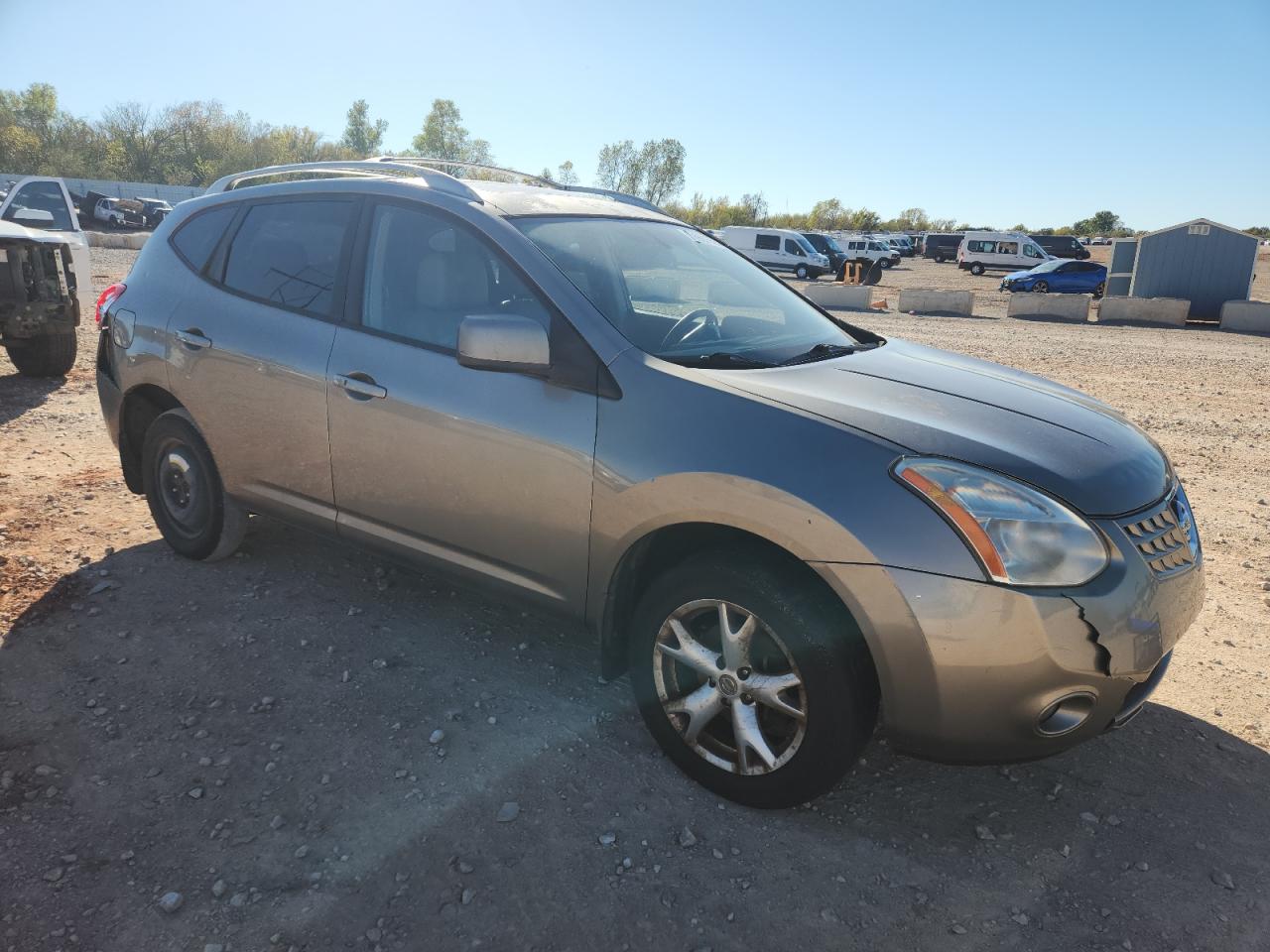 2009 Nissan Rogue S Tan vin: JN8AS58V09W161460