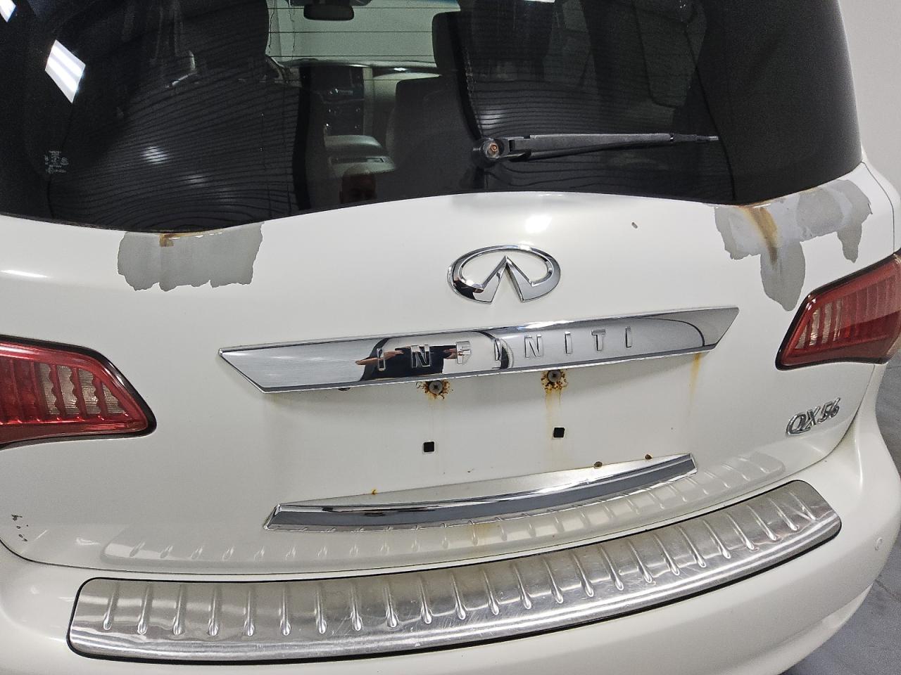 2013 Infiniti Qx56 Base White vin: JN8AZ2NE9D9040481 Damage: Lift Gate, Peeling, > 12 Inches