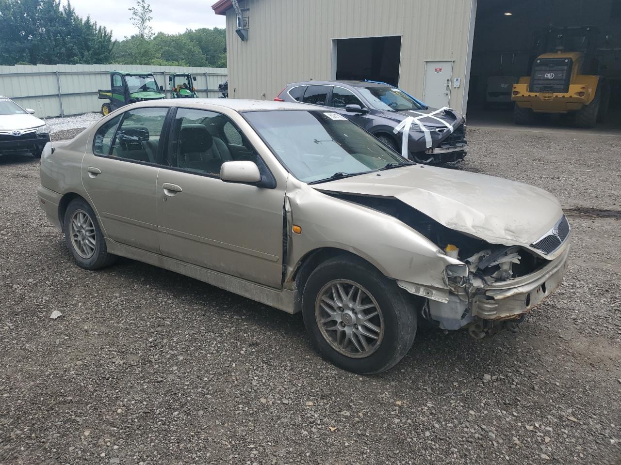1999 Infiniti G20    Gold vin: JNKCP11A0XT009374