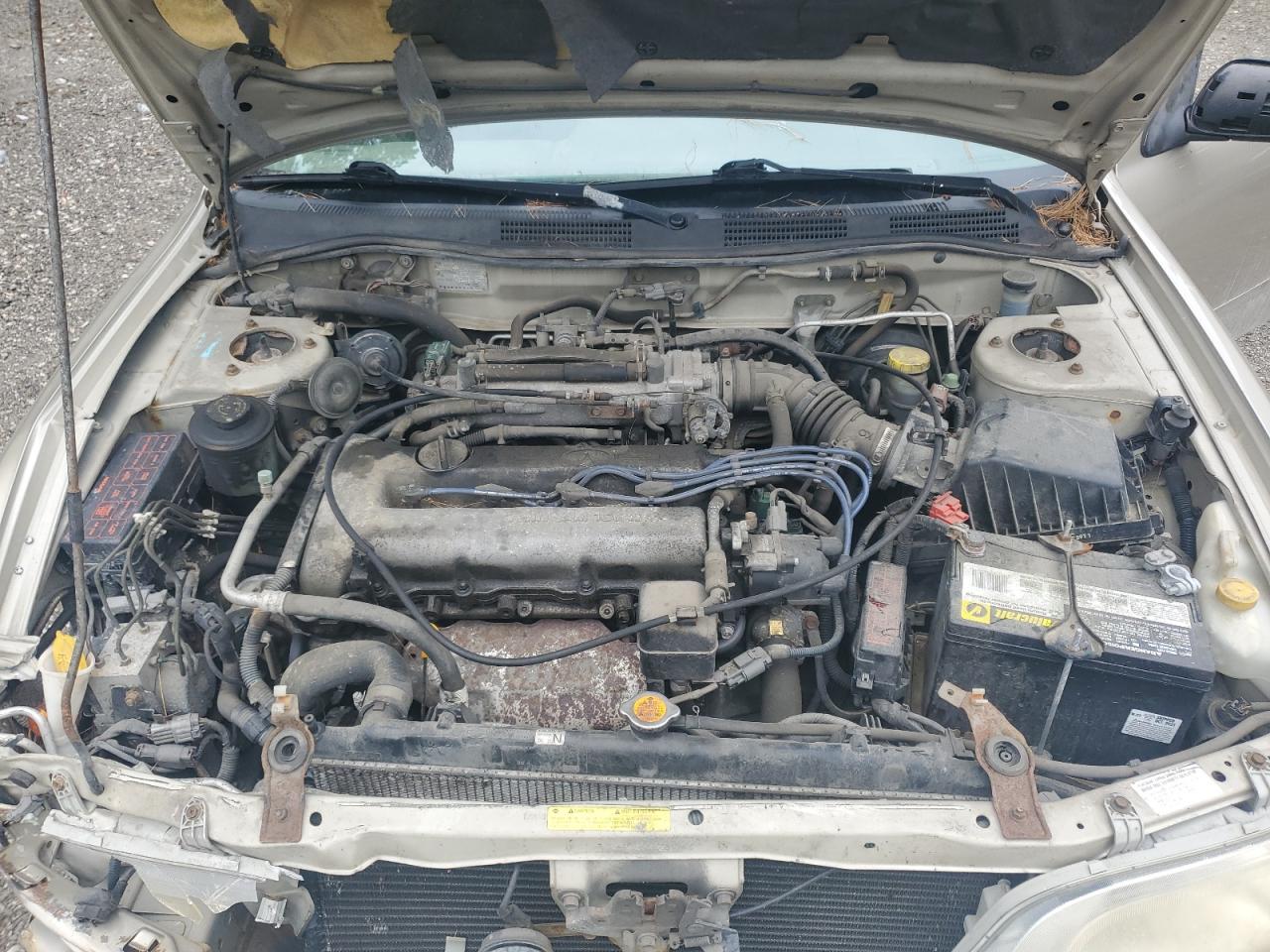 1999 Infiniti G20    Gold vin: JNKCP11A0XT009374