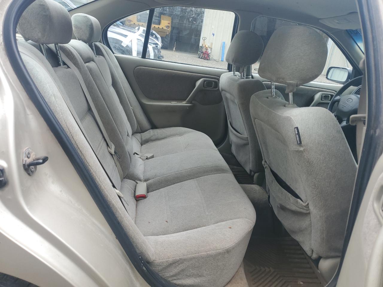 1999 Infiniti G20    Gold vin: JNKCP11A0XT009374