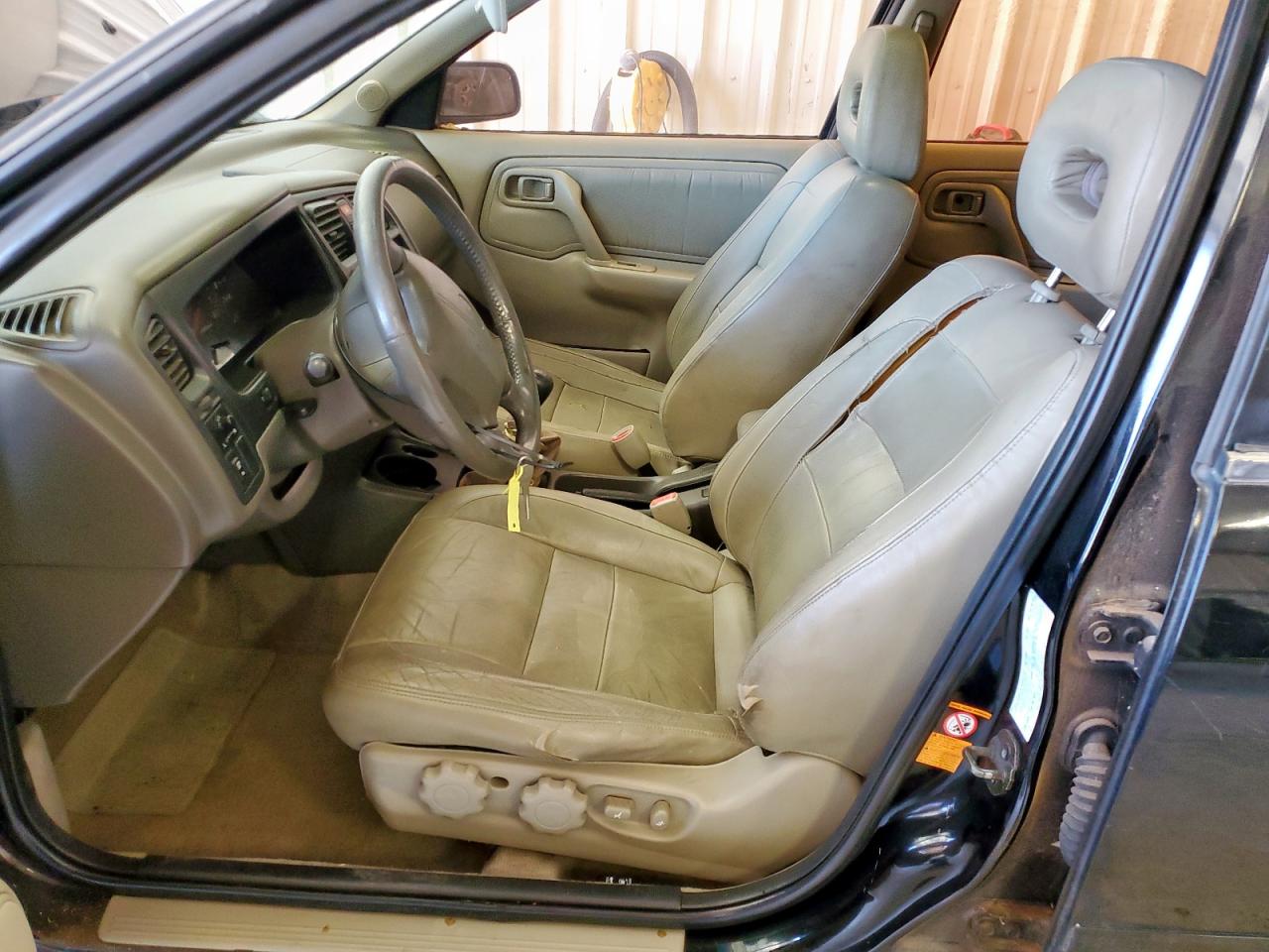 1999 Infiniti G20    Black vin: JNKCP11A6XT012859