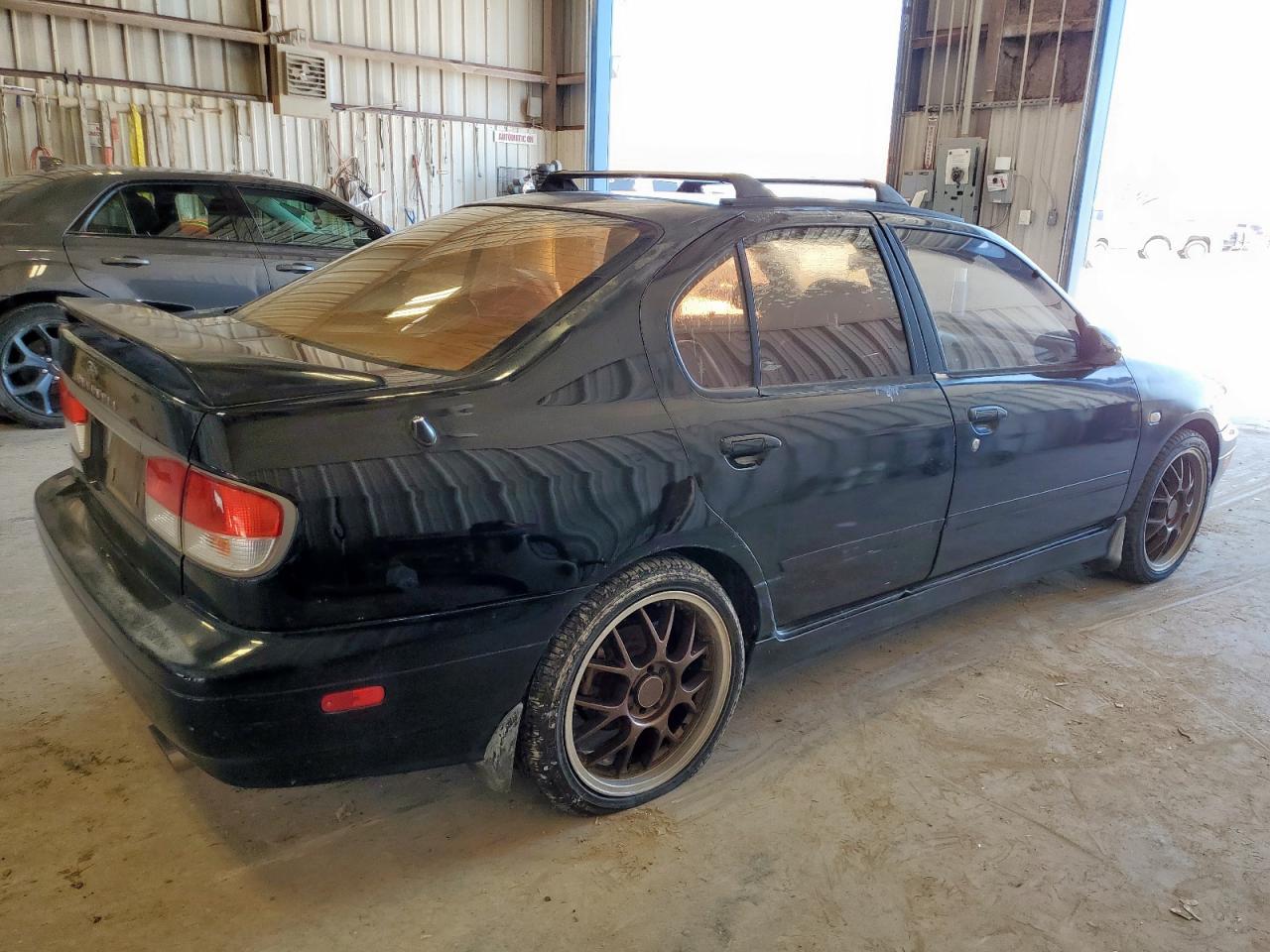 1999 Infiniti G20    Black vin: JNKCP11A6XT012859