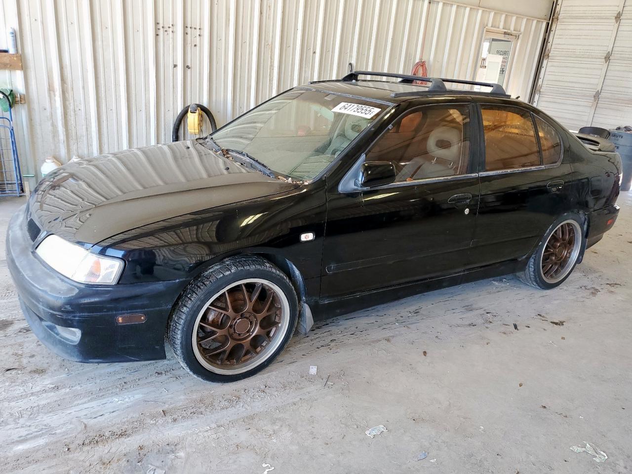 1999 Infiniti G20    Черный vin: JNKCP11A6XT012859