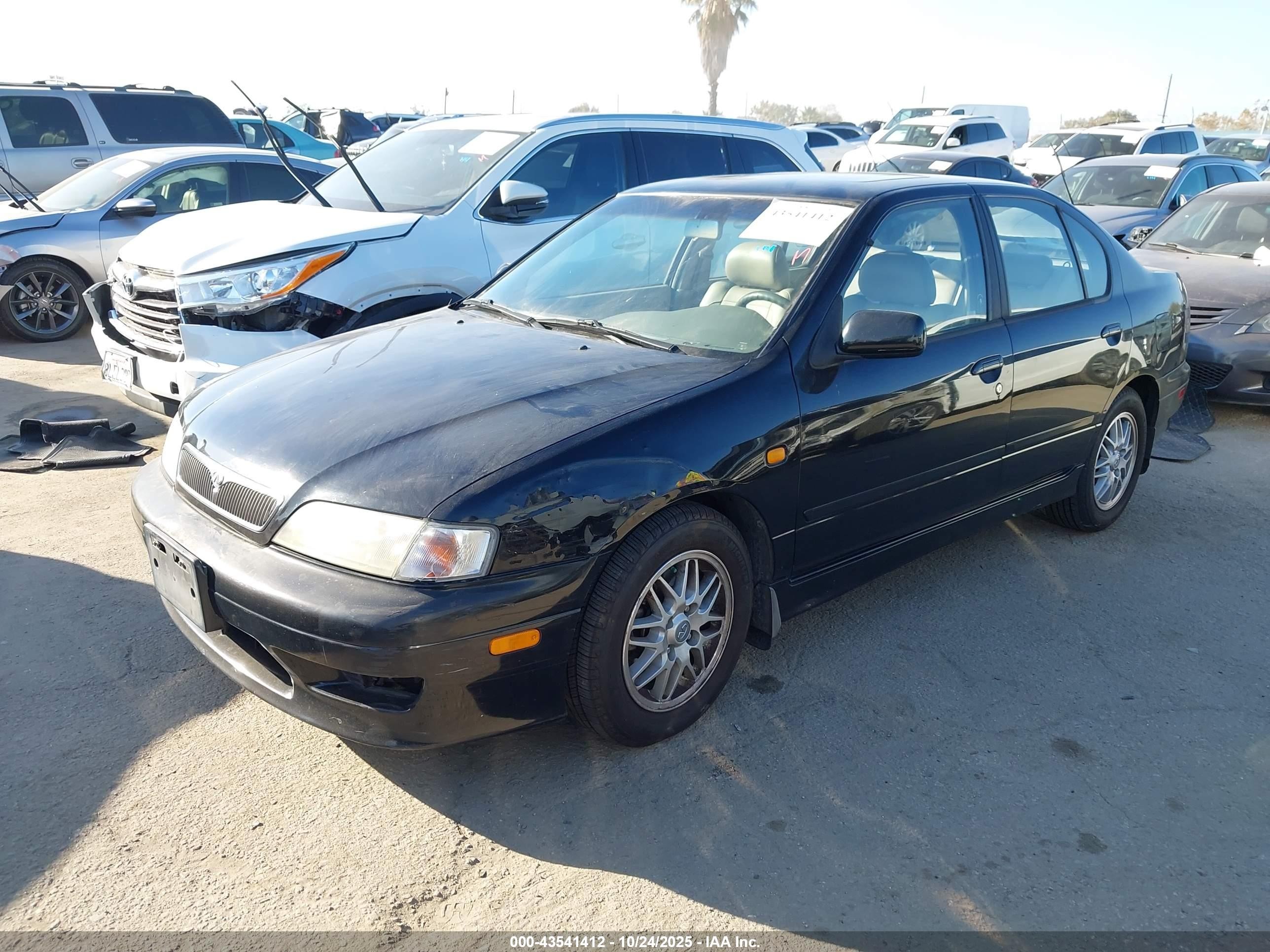 1999 Infiniti G20 Standard/touring Black vin: JNKCP11A8XT019974