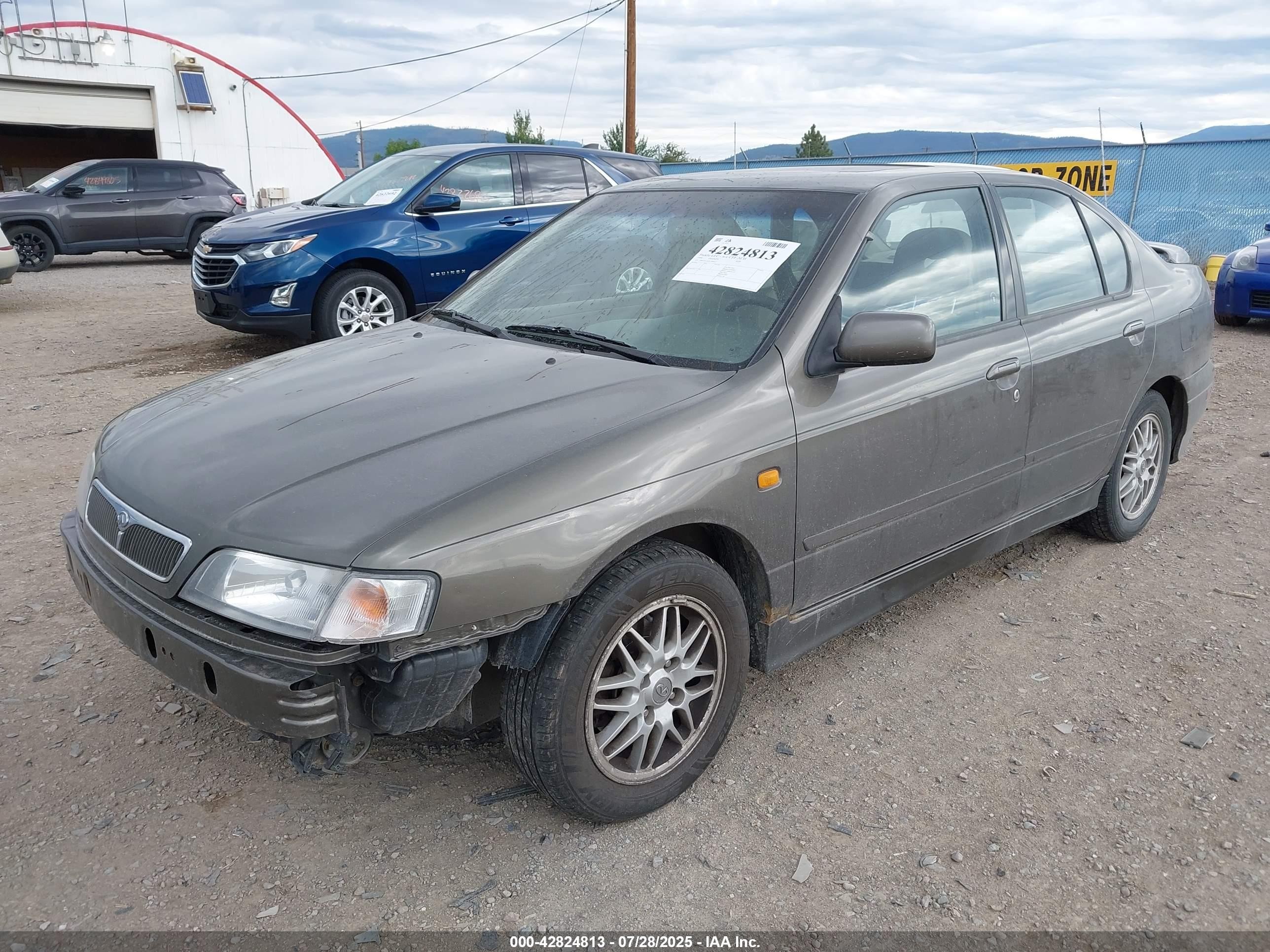 1999 Infiniti G20 Standard/touring Dark Brown vin: JNKCP11A9XT000513