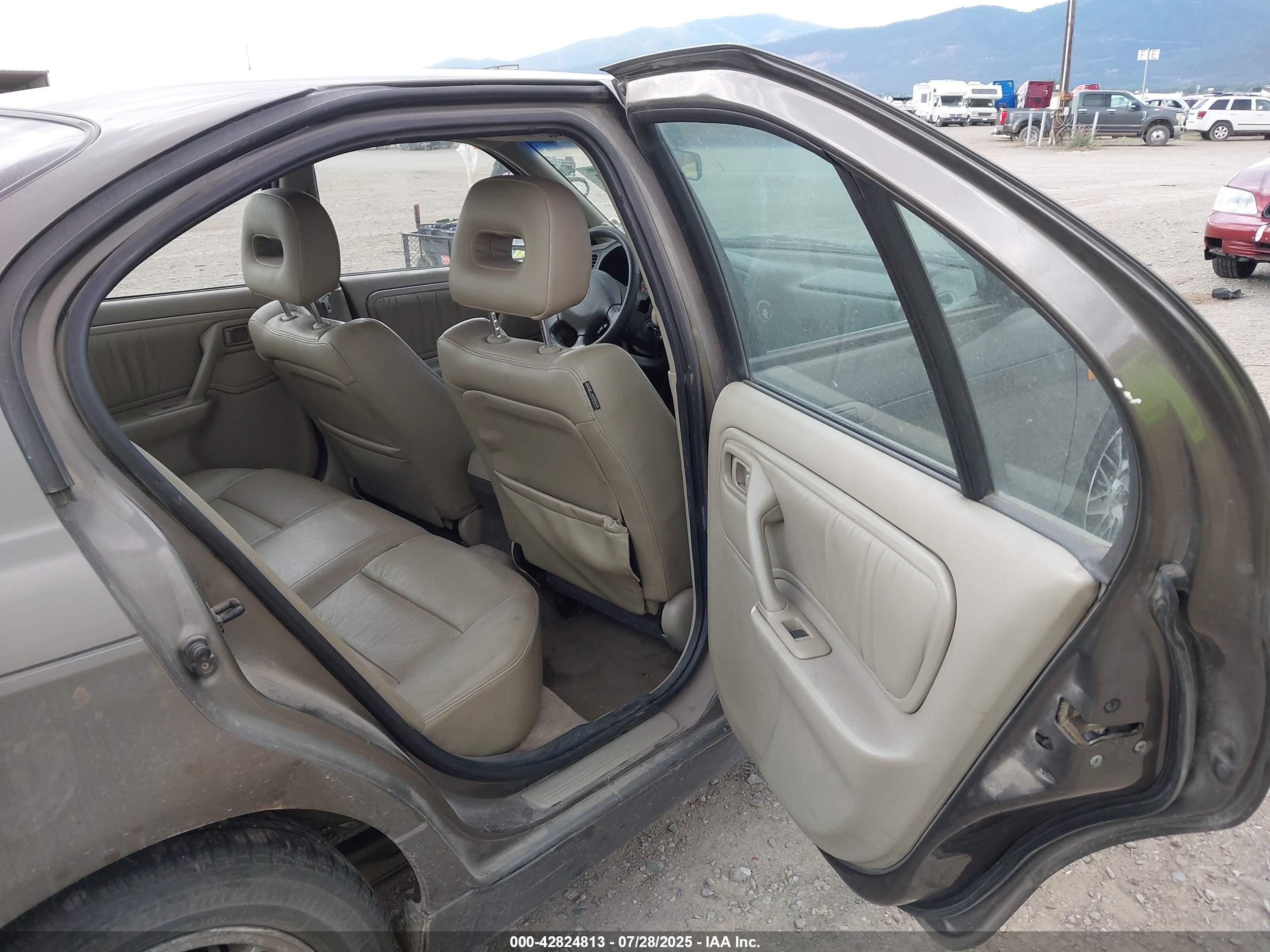 1999 Infiniti G20 Standard/touring Dark Brown vin: JNKCP11A9XT000513