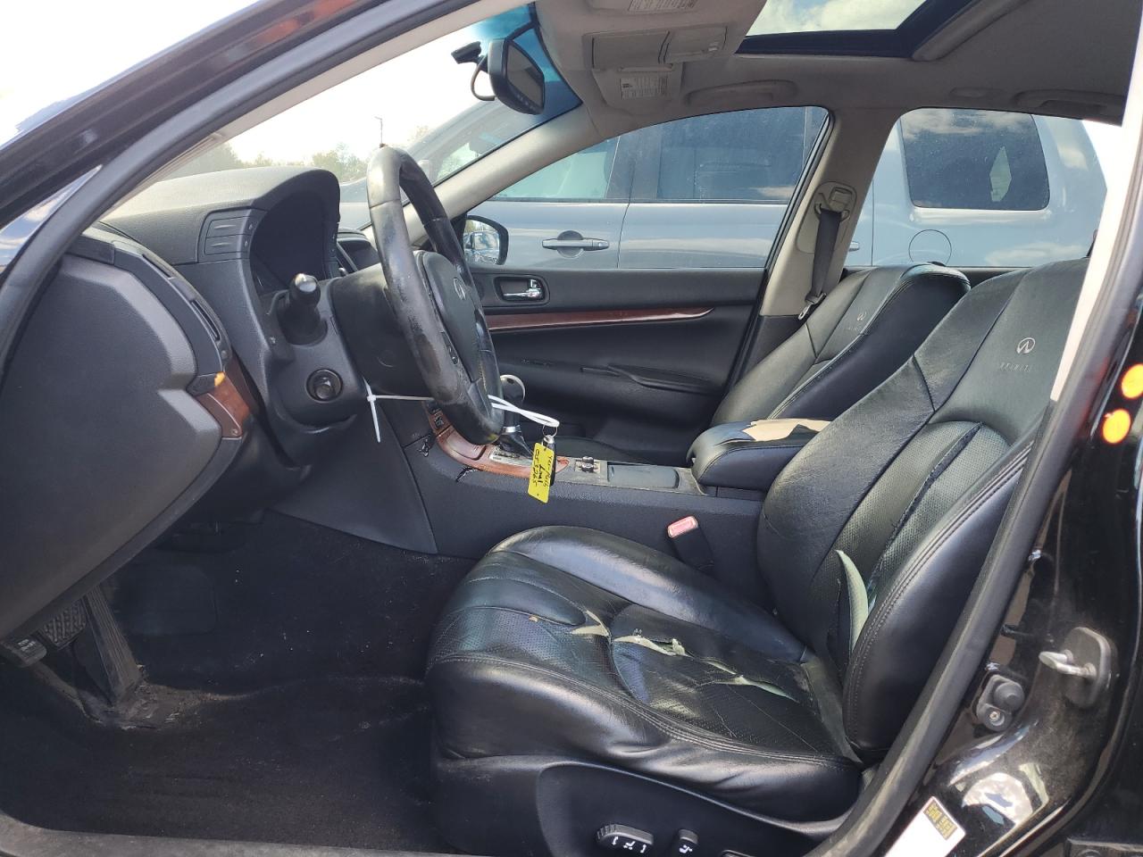 2009 Infiniti G37 Sedan X Black vin: JNKCV61F19M053265 Damage: Left Front Seat, Torn, > 12 Inches