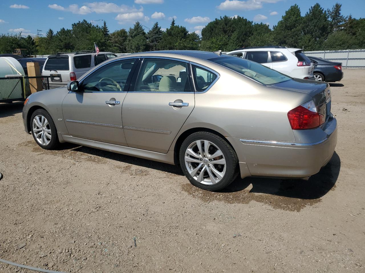 2009 Infiniti M35 Base Tan vin: JNKCY01E29M802201