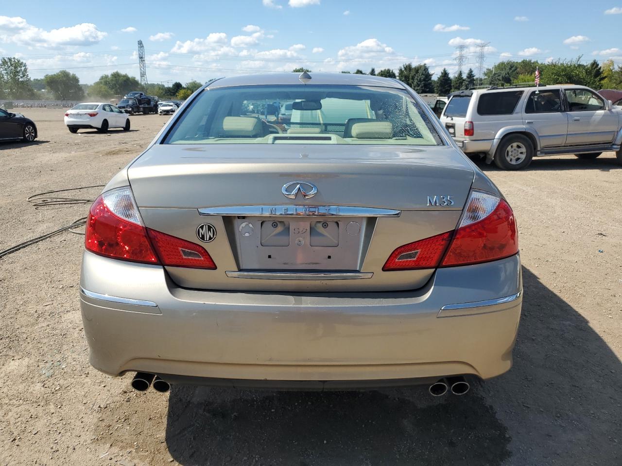 2009 Infiniti M35 Base Tan vin: JNKCY01E29M802201
