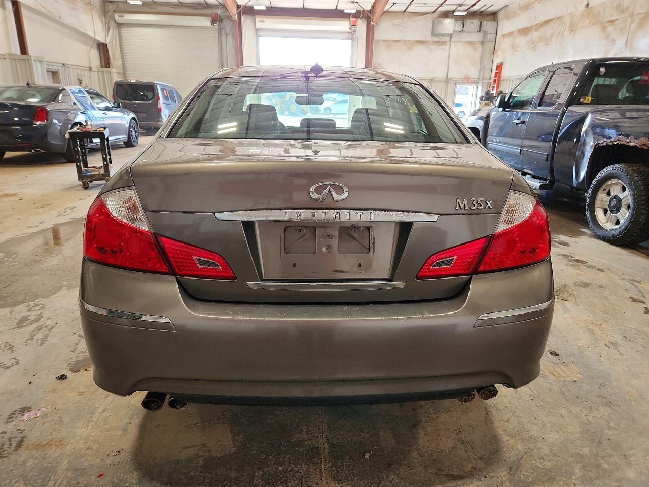 2009 Infiniti M35 X Tan vin: JNKCY01F09M851437