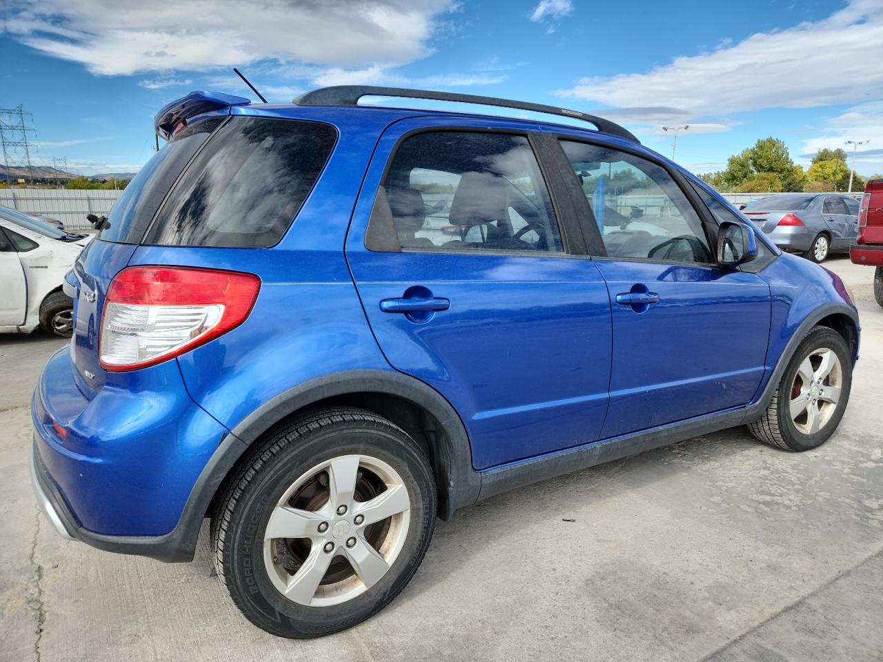 2012 Suzuki Sx4 Blue vin: JS2YB5A32C6304750