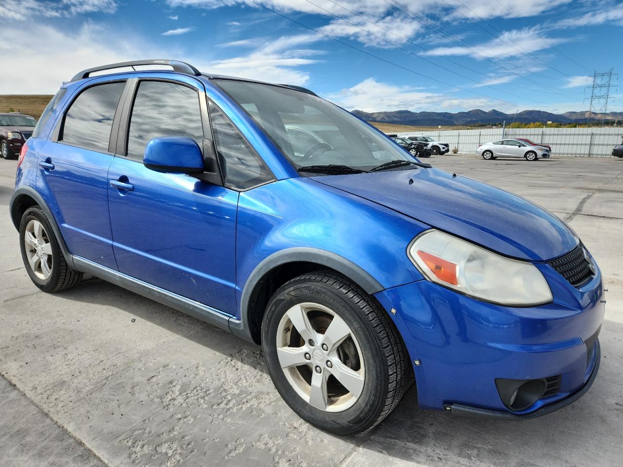 2012 Suzuki Sx4 Blue vin: JS2YB5A32C6304750