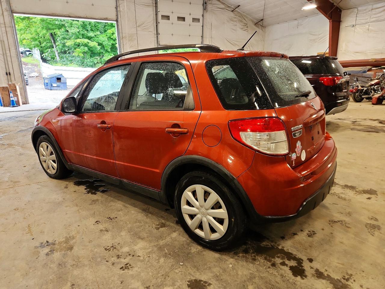 2010 Suzuki Sx4 Orange vin: JS2YB5A33A6300218