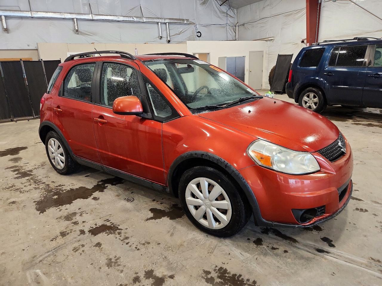2010 Suzuki Sx4 Orange vin: JS2YB5A33A6300218