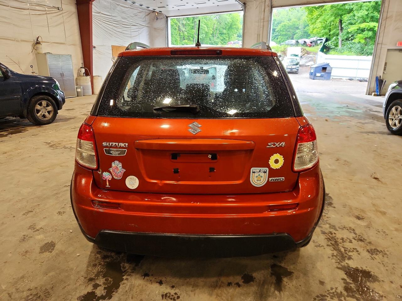 2010 Suzuki Sx4 Orange vin: JS2YB5A33A6300218
