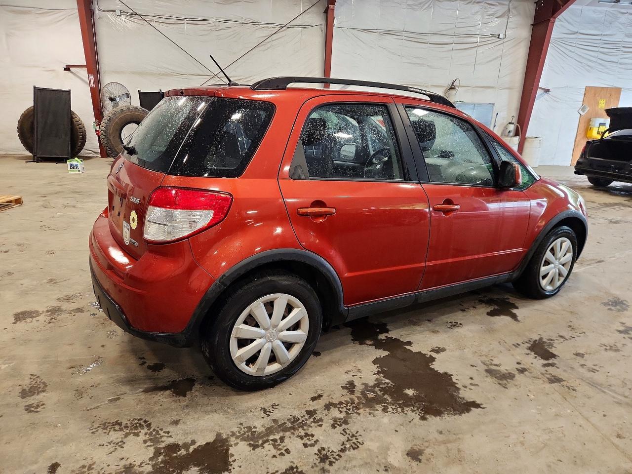 2010 Suzuki Sx4 Orange vin: JS2YB5A33A6300218
