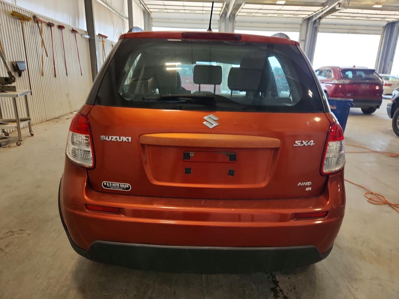 2013 Suzuki Sx4 Orange vin: JS2YB5A37D6101354