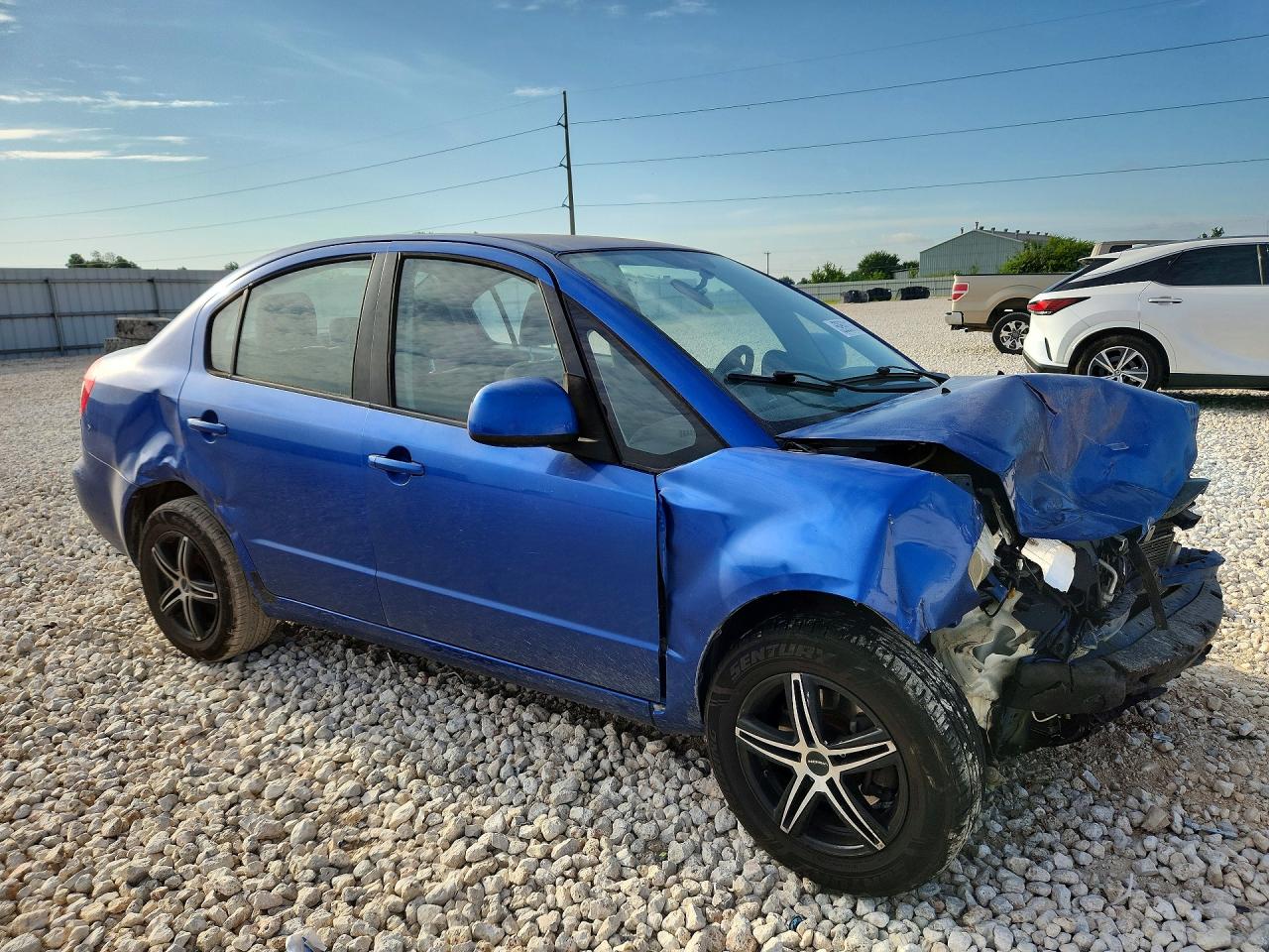 2013 Suzuki Sx4 Le Blue vin: JS2YC5A31D6100861