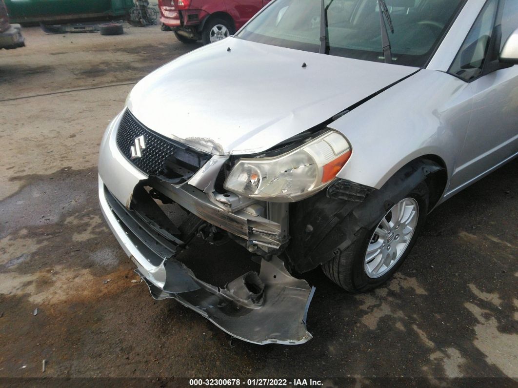 2013 Suzuki Sx4 Le Popular Silver vin: JS2YC5A33D6100537